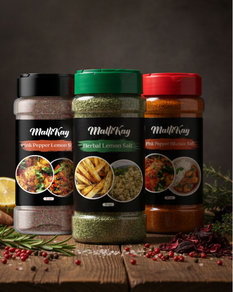 Three spice jars with different colored lids displayed on a dark surface.